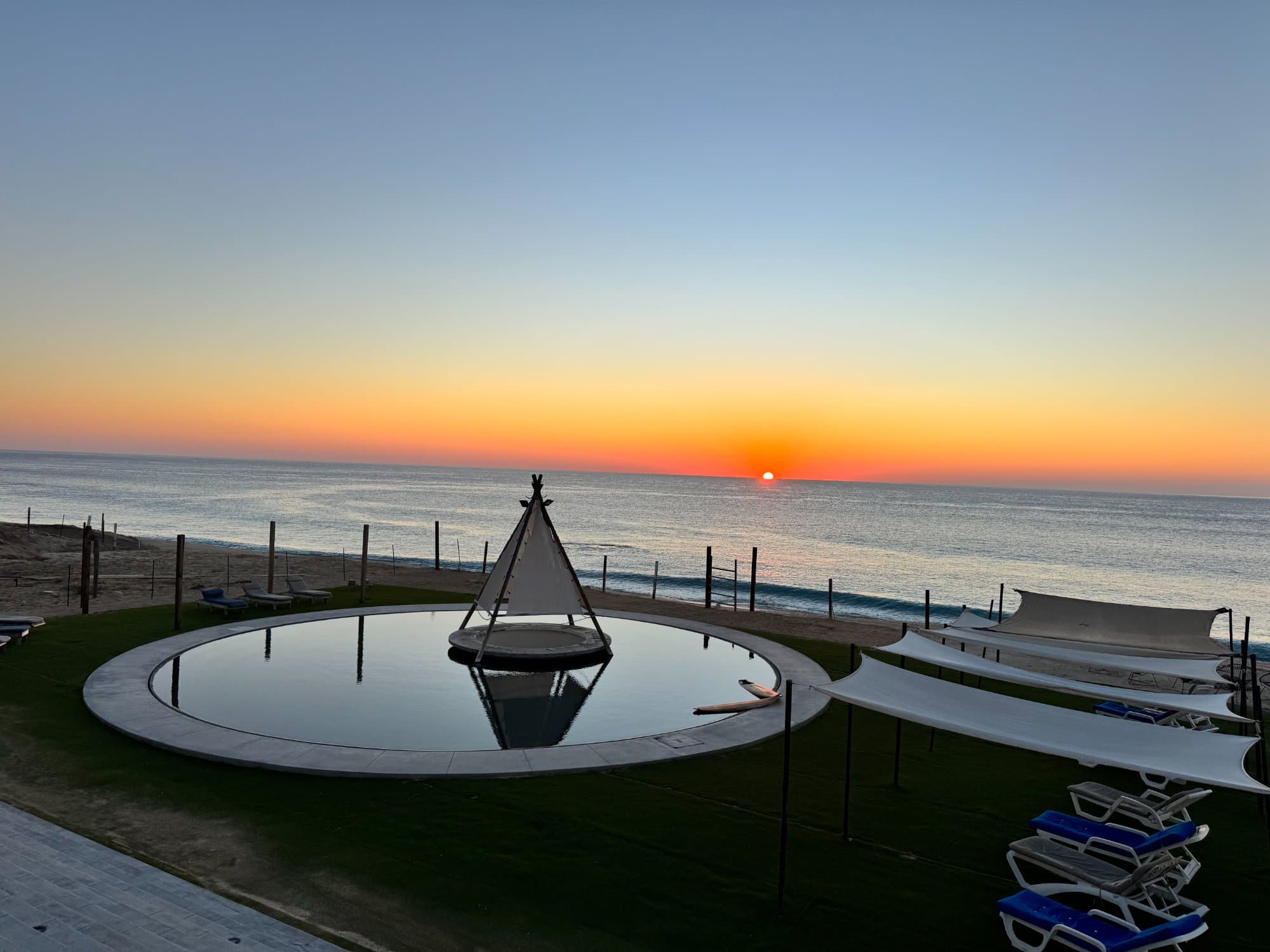 Pool and tipi at golden hour