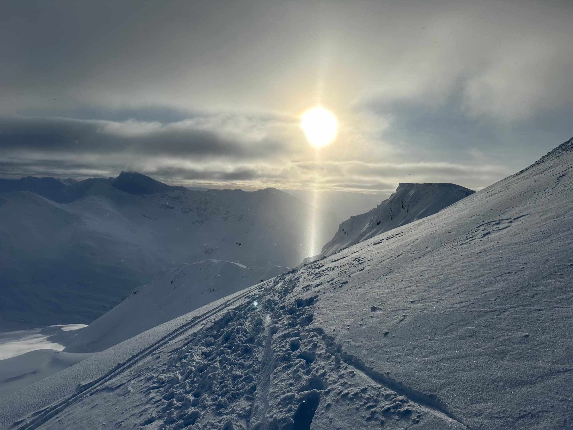 Sun breaking over a glacier in the Darwin Range