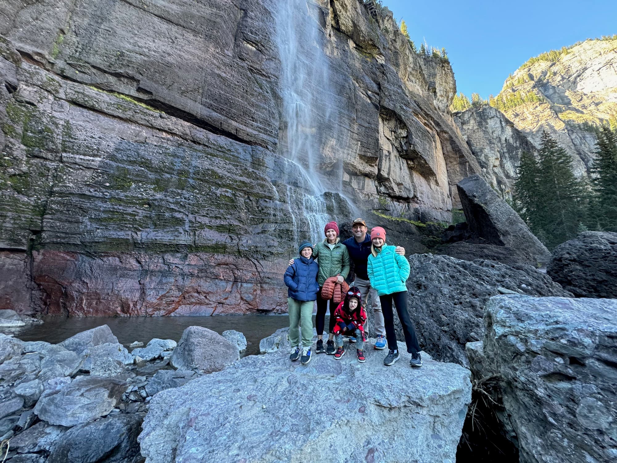 Waterfall cascading through lush jungle valley