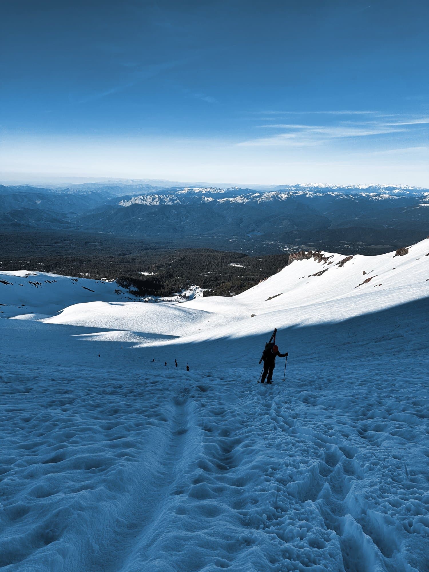 Descending a vast snowfield — the solitude that drives us